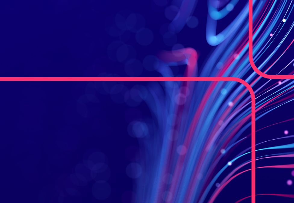 Abstract digital design with flowing pink and blue curved lines on deep blue background