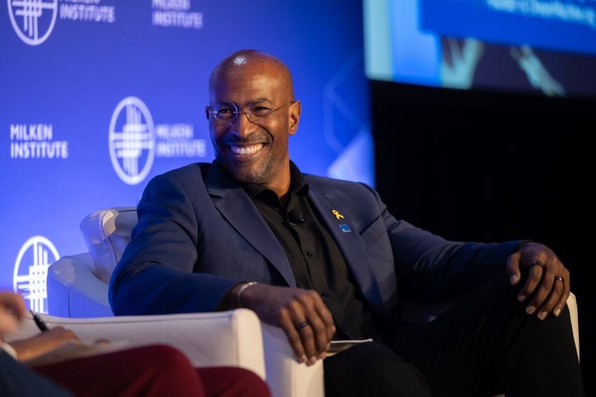 Van Jones smiling and speaking during a panel discussion at the Milken Institute’s Future of Finance event.