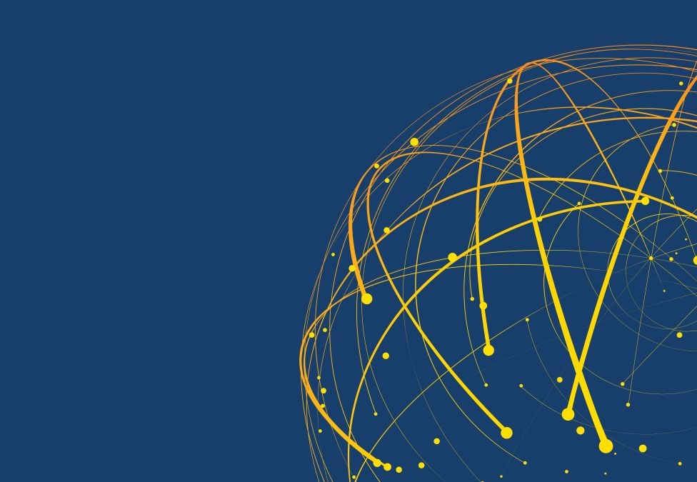A globe posed on a series of charts.
