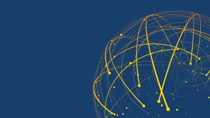 A globe posed on a series of charts.