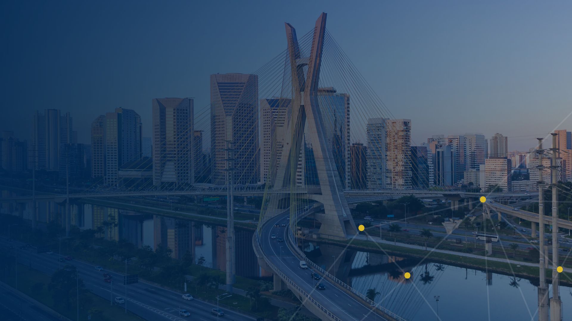 An image of a São Paulo cityscape with a bridge and a dark blue overlay with yellow connecting dots and lines.