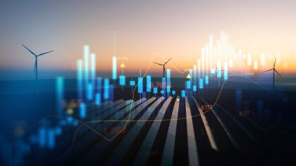 Wind turbines on farmland at sunset with glowing city skyline overlay