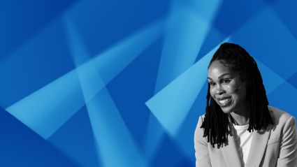 Woman with long dark hair against blue geometric background